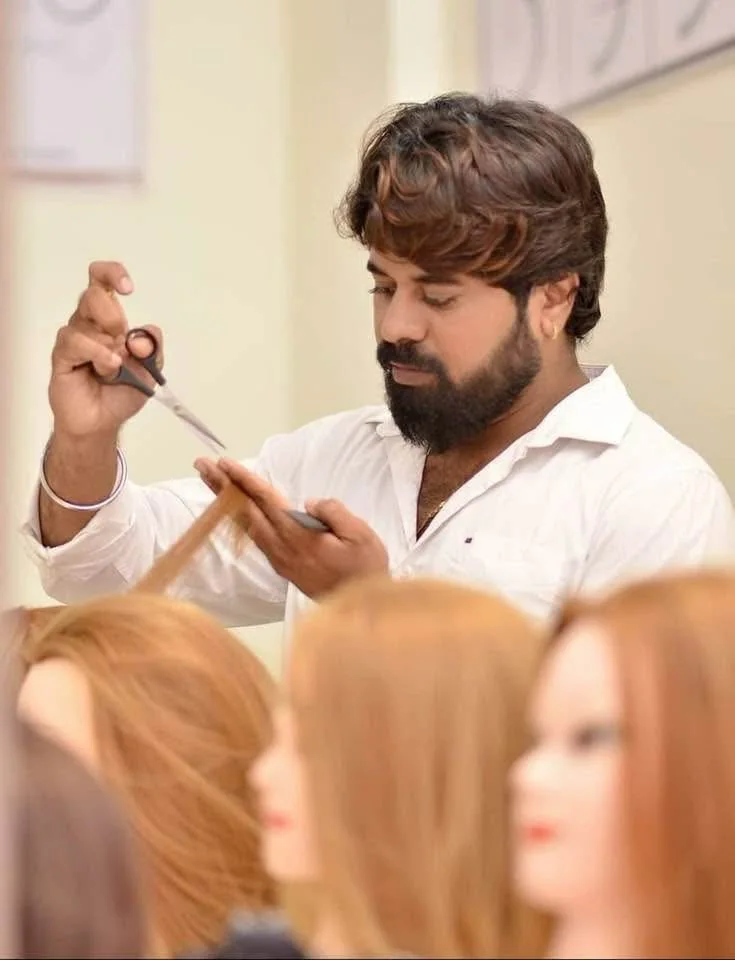Bhavesh Bidve conducting a professional hairstyling training session at The 7S Academy